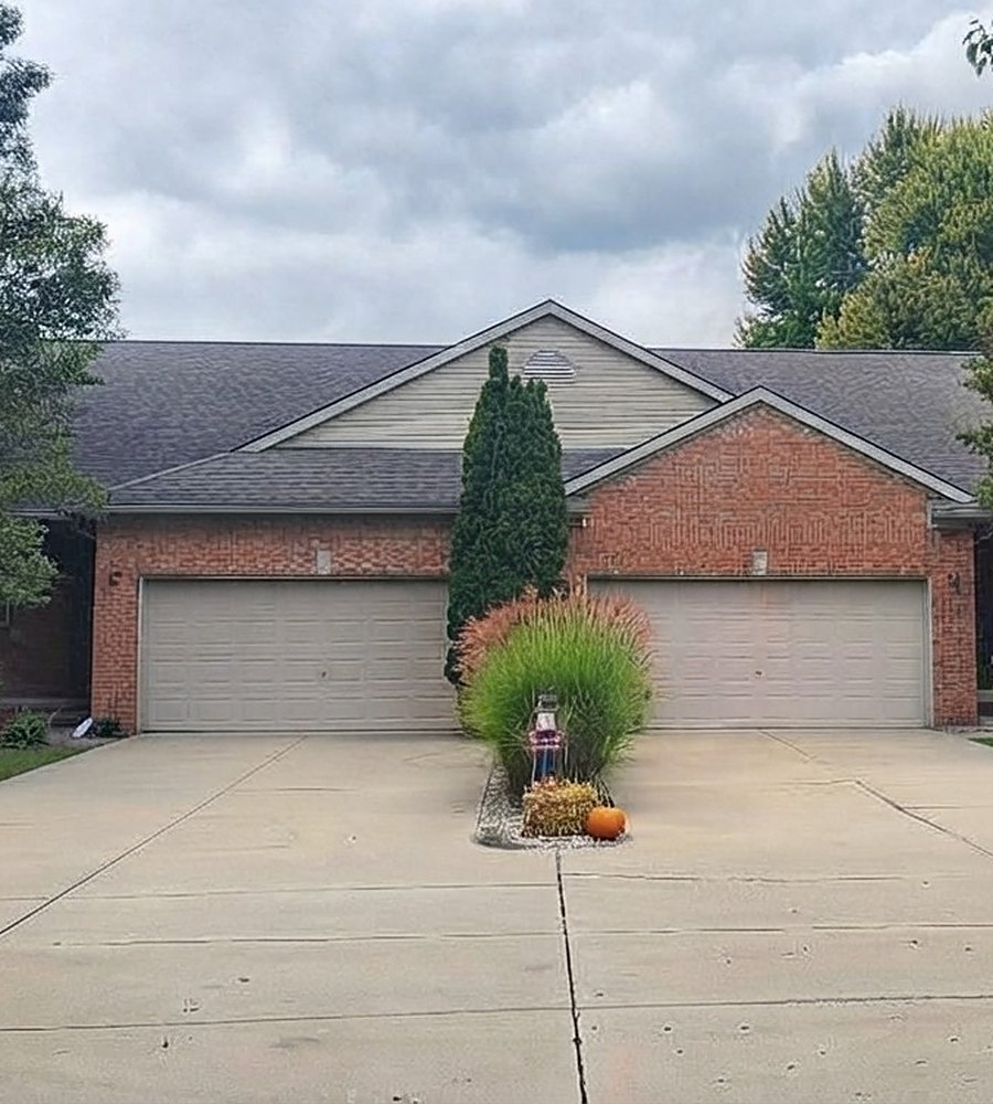 Brick duplex with attached two-car garages