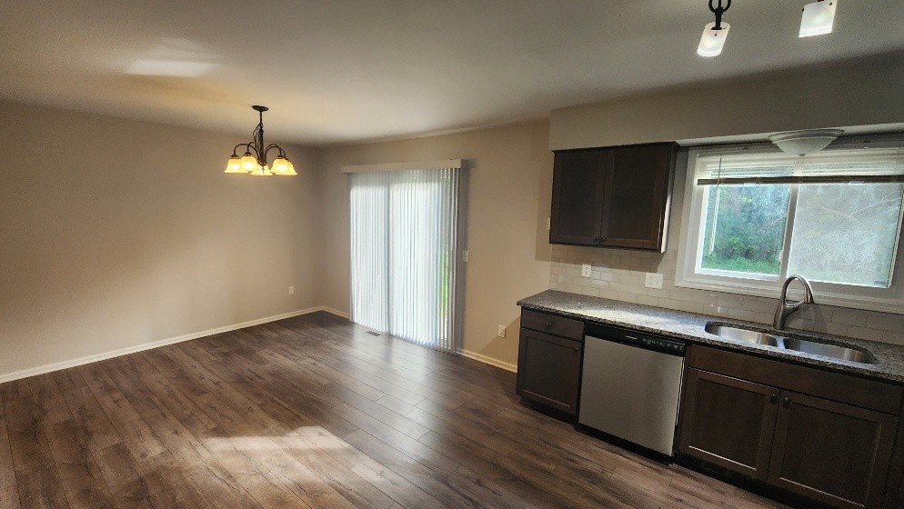 Kitchen and dinette with a patio door and stainless steel appliances