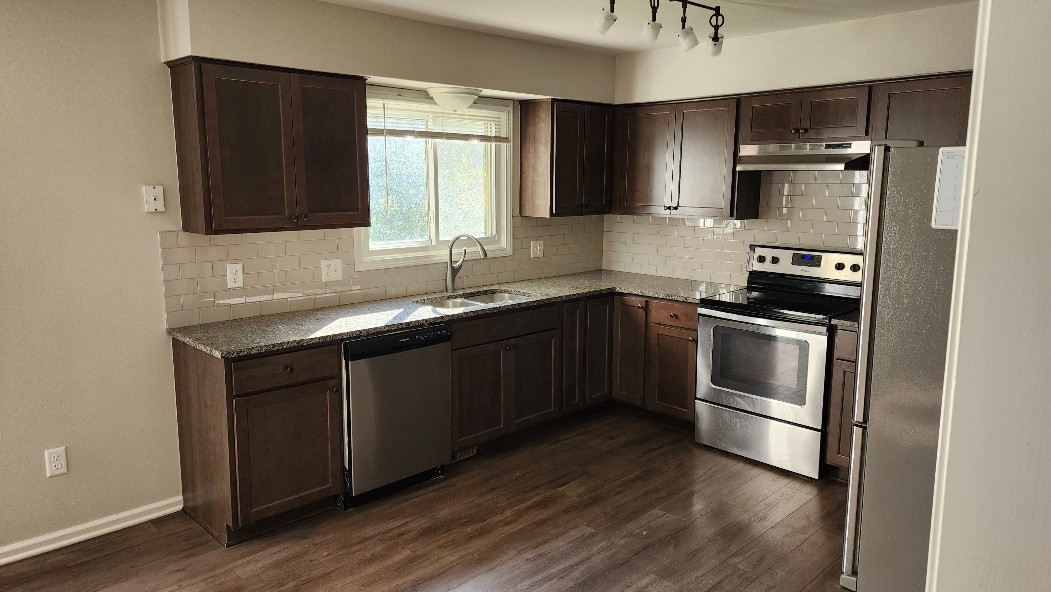 Kitchen with maple cabinets, granite counters and stainless steel appliances
