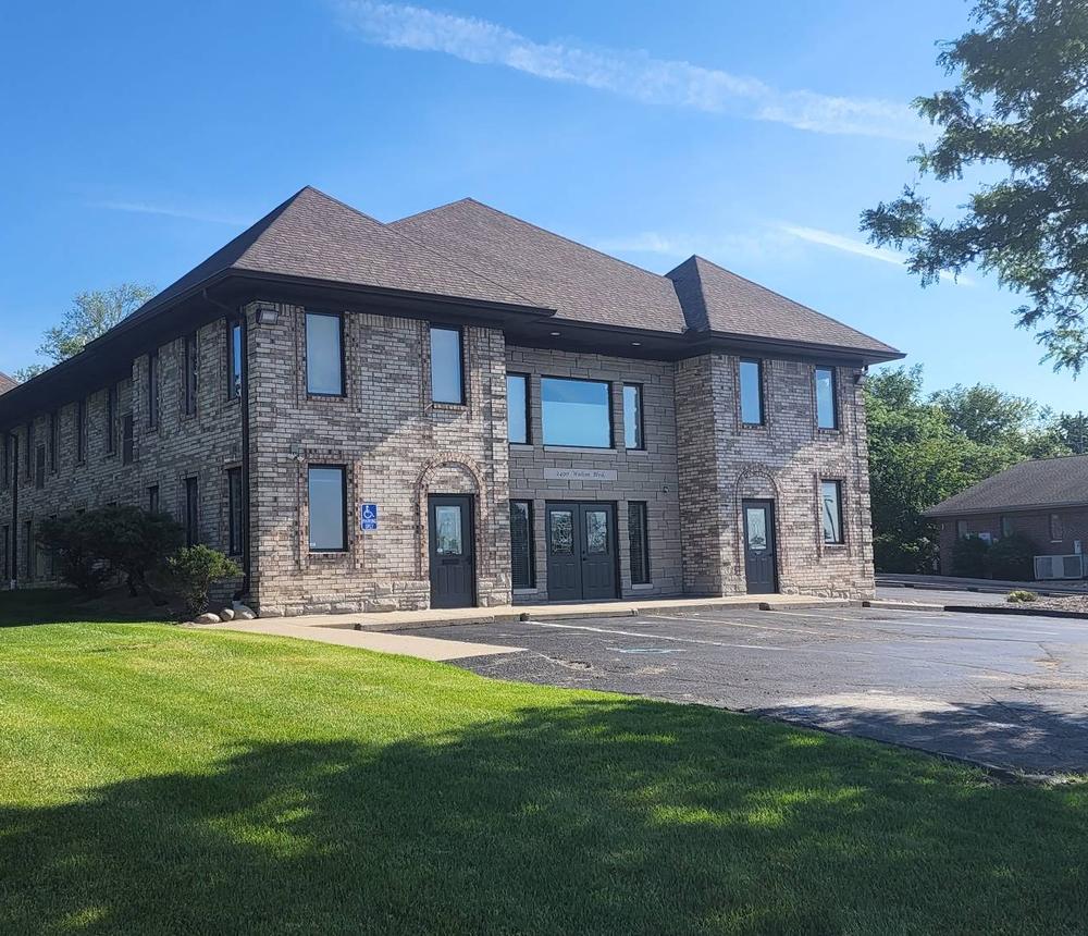 Two-storey brick and stone office building at 2490 Walton Boulevard