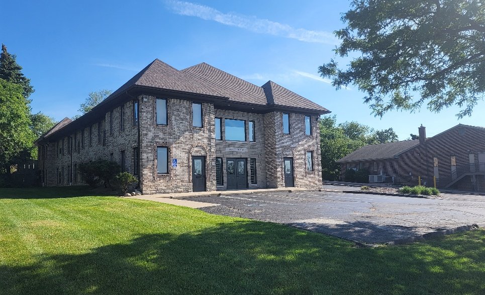 Two-storey brick and stone office building at 2490 Walton Boulevard