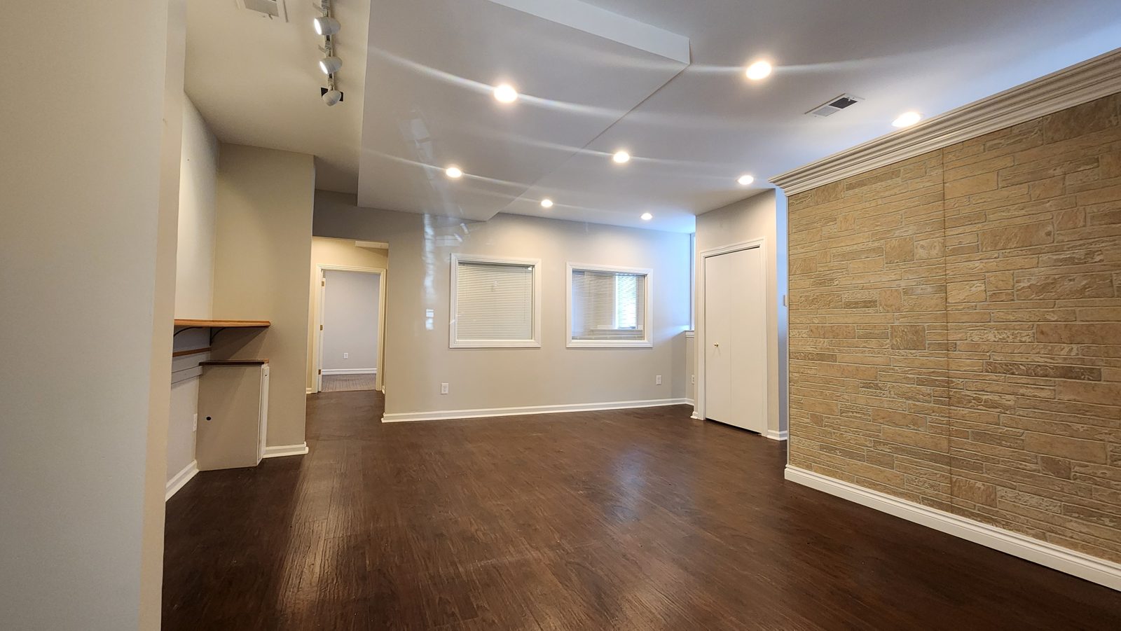 Suite 101 workspace with windows and a storage closet